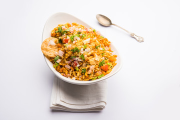 Bhelpuri Chaat/chat is a road side tasty food from India, served in a bowl or plate. selective focus