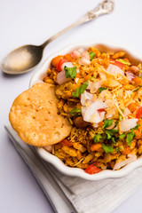 Bhelpuri Chaat/chat is a road side tasty food from India, served in a bowl or plate. selective focus