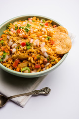 Bhelpuri Chaat/chat is a road side tasty food from India, served in a bowl or plate. selective focus