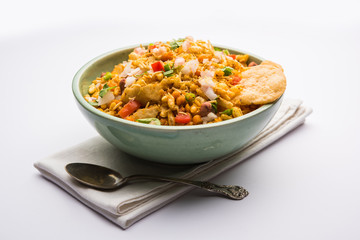 Bhelpuri Chaat/chat is a road side tasty food from India, served in a bowl or plate. selective focus