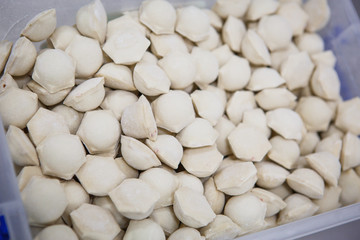 The process of making dumplings, dumplings close-up. The rolling test, the unfolding of beef, dumpling making gloved hands.