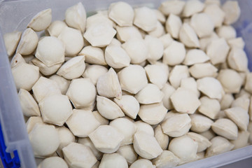 The process of making dumplings, dumplings close-up. The rolling test, the unfolding of beef, dumpling making gloved hands.
