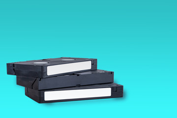 VHS videotapes on a blue background folded vertically