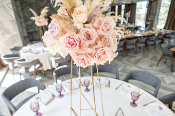 Wedding Banquet or gala dinner. The chairs and table for guests, served with cutlery and crockery....