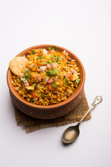 Bhelpuri Chaat/chat is a road side tasty food from India, served in a bowl or plate. selective focus