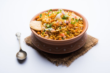 Bhelpuri Chaat/chat is a road side tasty food from India, served in a bowl or plate. selective focus