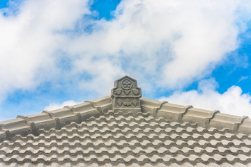 traditional Okinawa tile roof decorated with card game designs such as clover, heart, tile and spades