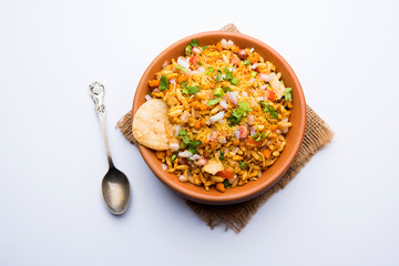 Bhelpuri Chaat/chat is a road side tasty food from India, served in a bowl or plate. selective focus