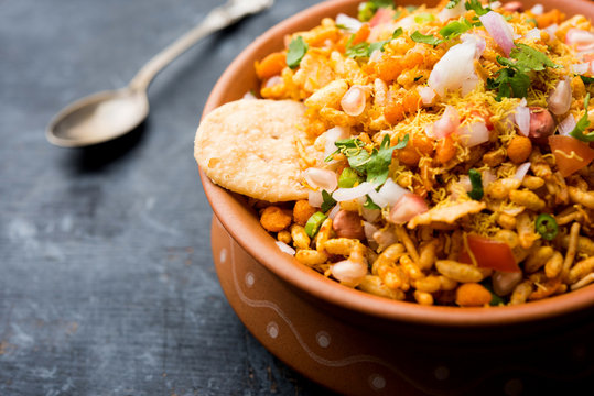 Bhelpuri Chaat/chat is a road side tasty food from India, served in a bowl or plate. selective focus