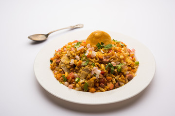 Bhelpuri Chaat/chat is a road side tasty food from India, served in a bowl or plate. selective focus