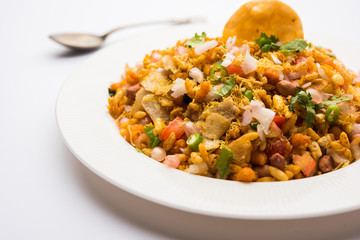 Bhelpuri Chaat/chat is a road side tasty food from India, served in a bowl or plate. selective focus