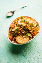 Bhelpuri Chaat/chat is a road side tasty food from India, served in a bowl or plate. selective focus