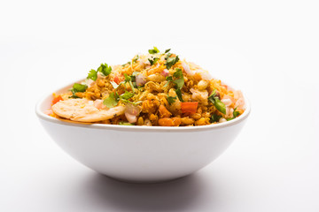 Bhelpuri Chaat/chat is a road side tasty food from India, served in a bowl or plate. selective focus