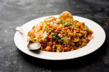 Bhelpuri Chaat/chat is a road side tasty food from India, served in a bowl or plate. selective focus