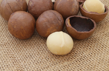 Macadamia nuts on jute burlap hessian background
