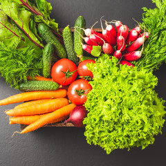 Fresh vegetables in wooden crate. Close up