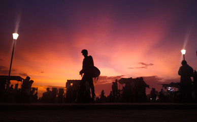 silhouette of construction workers at sunset