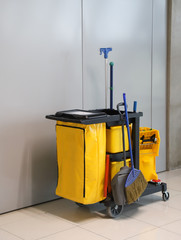 Closeup of janitorial, cleaning equipment and tools for floor cleaning. Vertical view.