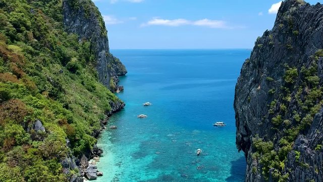 Low flying Aerial of Shimizu and Inatula island El Nido, Palawan, Philippines