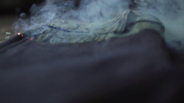 Gorgeous slow motion of jeans having a laser pattern printed on them in the fabrication texturing process.