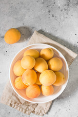 Apricots on a light background. Light grey background