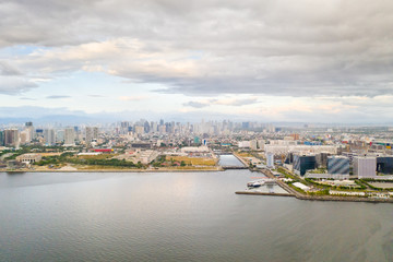 Manila city in the morning, view from above. Panorama of a large port city. City with modern buildings and skyscrapers. Manila, the capital of the Philippines. Asian metropolis.