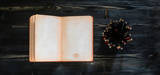 open book template + creative notepad and pencils flat lay top view