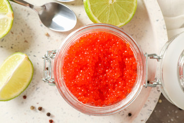 Appetizing composition with caviar and citrus on grey table, close up