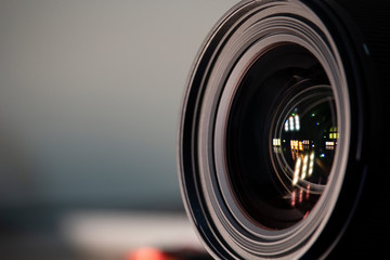 Camera lens on blurred background