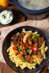 Fussili noodle with klaschise spicy goulash and paprika