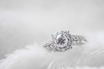 luxury jewelry diamond ring on white fur texture