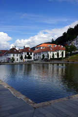 Fototapeta premium Travel to Norway, a small pool and a bright house on the other side of the city of Bergen