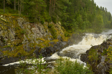Water dust over the waterfall Kivach, Karelia, Russia