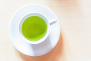 Fototapeta na wymiar hot green tea on the table