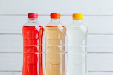 Rows of colorful drink plastic bottles close up