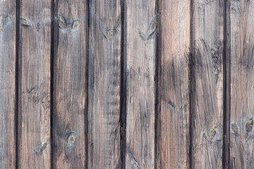 Wooden wall with natural boards. Brown knotted flooring texture for background