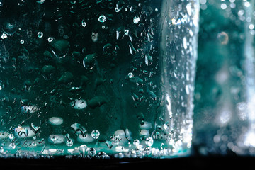 Close up of a sparkling water bottle with condensation on it
