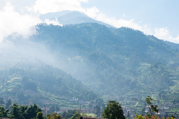 Scenic view of mountain peak and rural town in south east Asia.