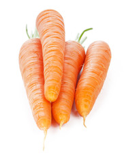 Isolated carrots. Heap of fresh carrots with stems isolated on white background