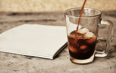 Iced coffee on stone background. Summer cold drink.