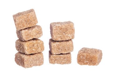 Brown cane sugar cubes isolated on white background