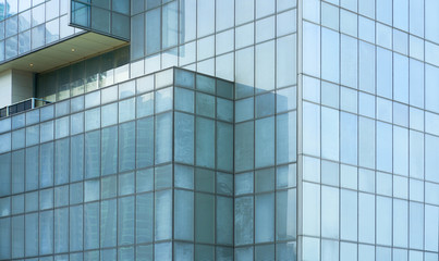 Fototapeta na wymiar Glass windows of high rise commercial skyscraper building , for business concept background .