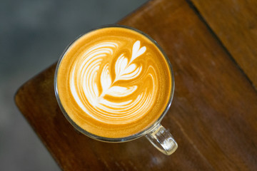 coffee latte on wood table,aerial view,sun light