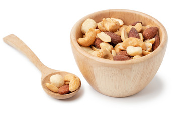 mixed nuts in white wooden bowl isolated on white background.