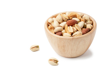 mixed nuts in white wooden bowl isolated on white background.