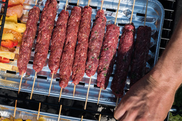  grilling meat and vegetables outdoor