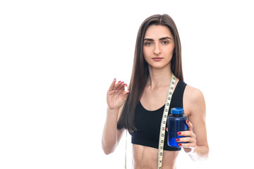 Young slim woman offering pills from bottle