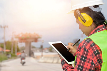 Supervisor using laptop at construction site