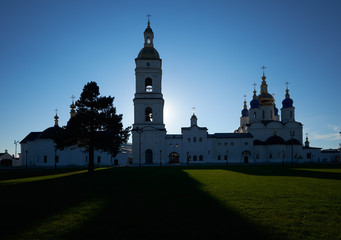 Fototapeta na wymiar Silhouette of Saint Sophia Cathedral with belfry in the sun backlighting. Tobolsk Kremlin. Russia