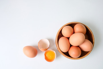 Fresh eggs from the farm placed on a white wooden table background